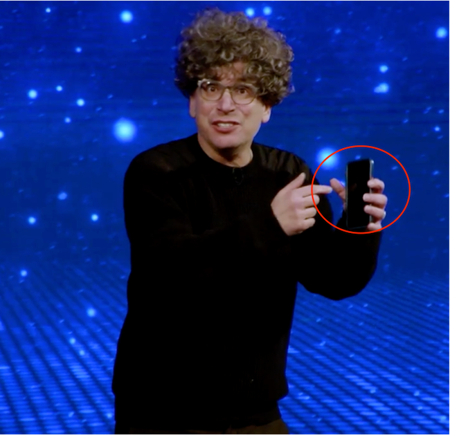 James holding a cell phone